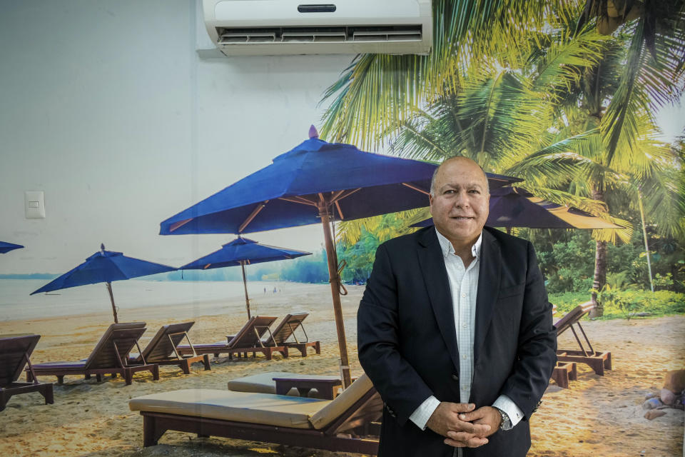 John Paul Spode, who has worked 35 years in the travel industry and manages NewStilo, a travel agency, poses for a portrait at his office in Santiago, Chile, Friday, March 25, 2022. Spode said few places have the demand for charter flights like Haiti, though he said it’s not an easy place for a business to operate. (AP Photo/Esteban Felix)