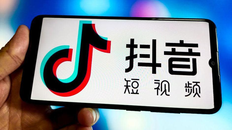 Logo of short video app Douyin on phone screen.