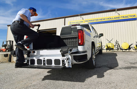 Local tractor dealership owner Mickey McMaster shows off his brand-new GMC Denali pickup truck in Decatur, Texas, U.S., February 4, 2019. REUTERS/Nick Carey