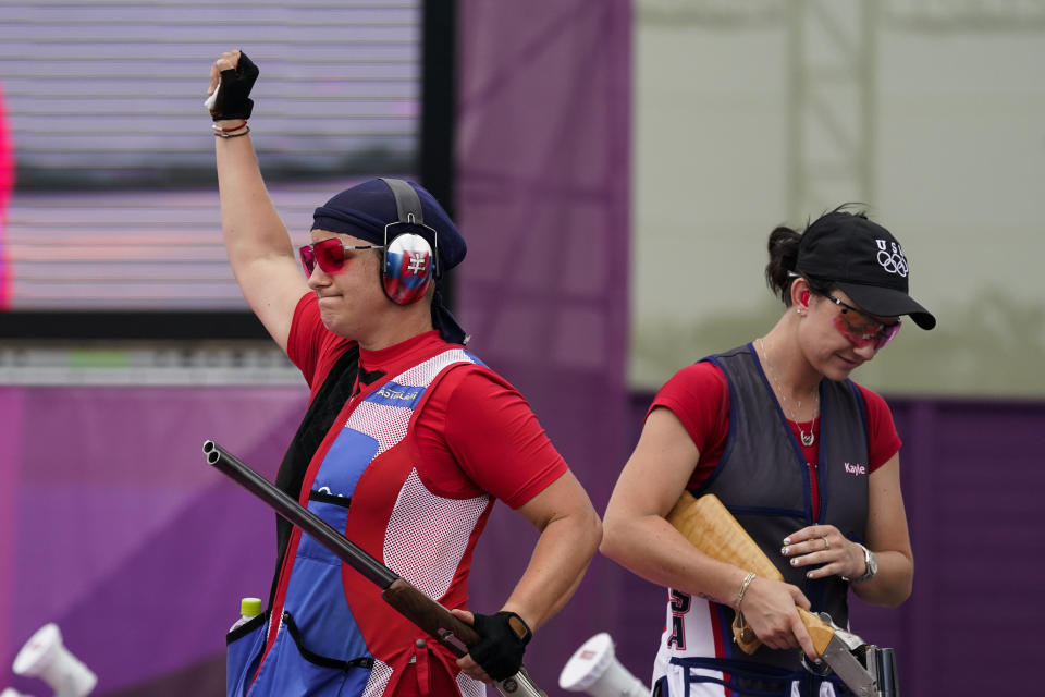 Zuzana Rehak Stefecekova, left, of Slovakia, celebrates taking the gold as Kayle Browning, of the United States, takes the gold in the women's trap at the Asaka Shooting Range in the 2020 Summer Olympics, Thursday, July 29, 2021, in Tokyo, Japan. (AP Photo/Alex Brandon)