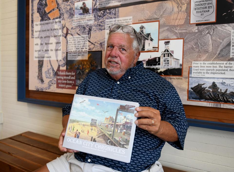 Bunk Mann holds his third book, Ocean City Chronicles, at the Ocean City Life Saving Station Museum Friday, Aug. 25, 2023, in Ocean City, Maryland.