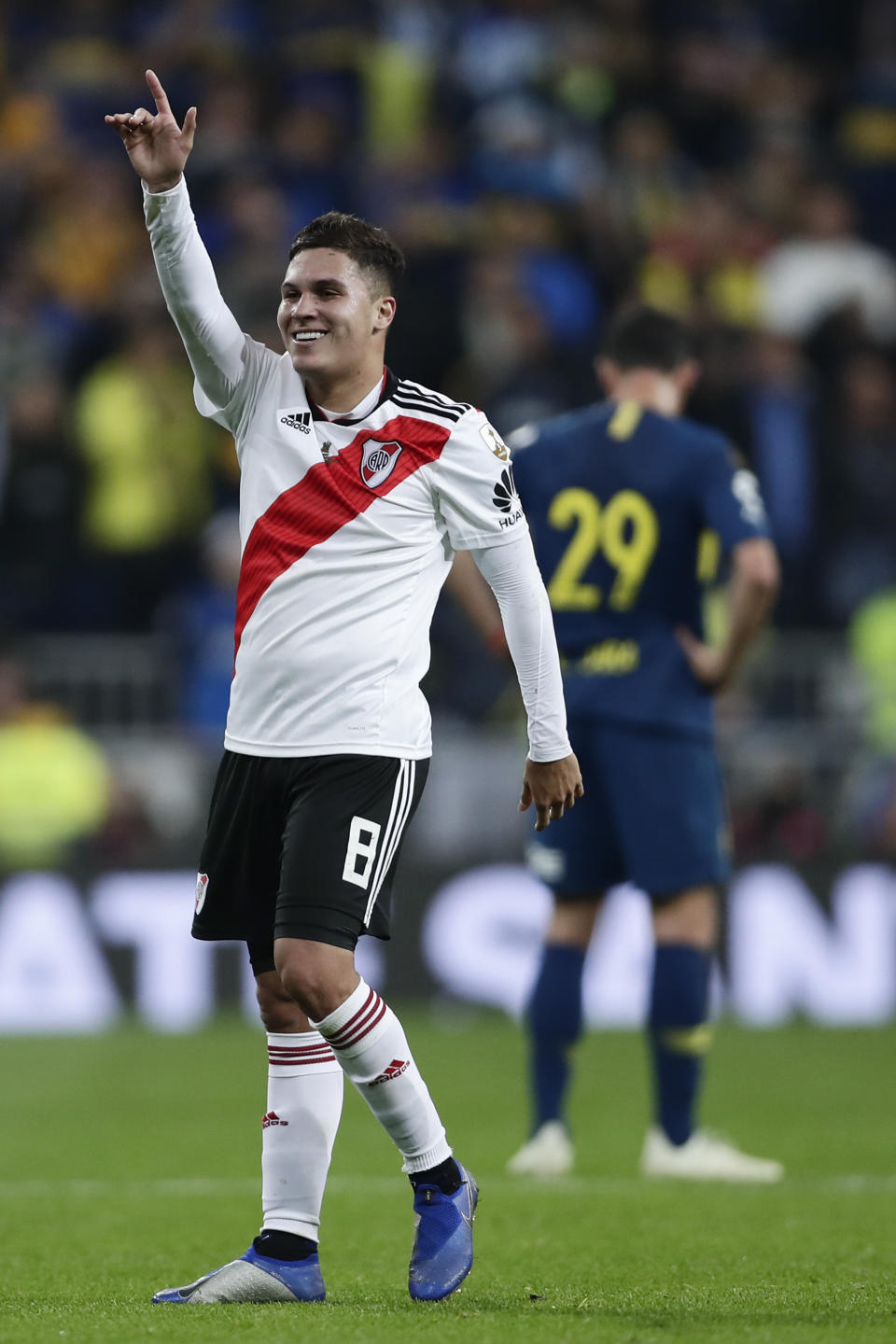 Juan Quintero of Argentina's River Plate celebrates beating 3-1 Argentina's Boca Juniors during the Copa Libertadores final soccer match at the Santiago Bernabeu stadium in Madrid, Spain, Sunday, Dec. 9, 2018. (AP Photo/Manu Fernandez)