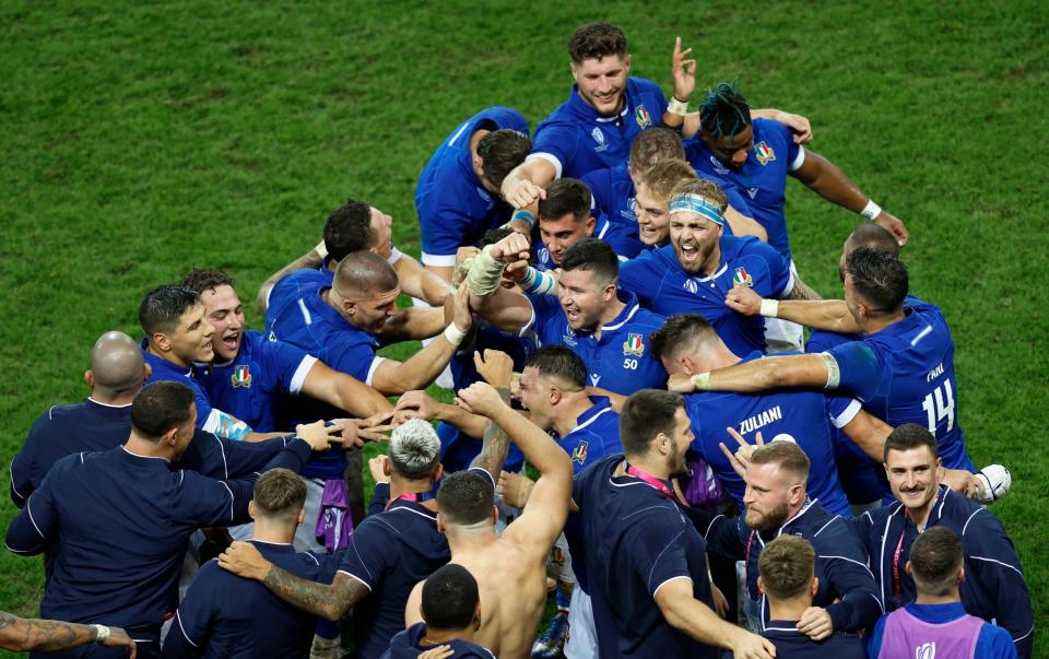 Italy players celebrate after the final whistle