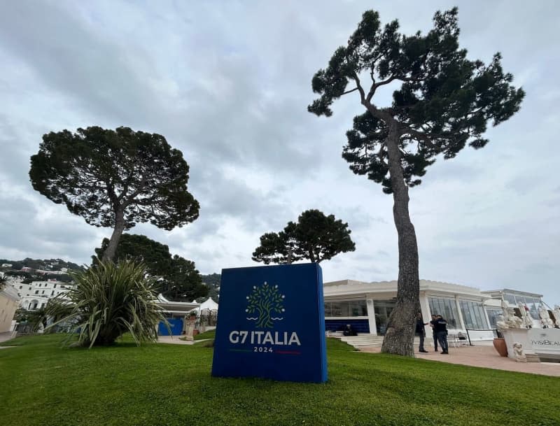 The logo of the Italian G7 presidency are pictured on the grounds of the foreign ministers' conference hotel.  Ahead of the meeting in Turin of the G7 environment and energy ministers, experts say the group's climate protection policy is inadequate and set to fall far short of targets. Christoph Sator/dpa