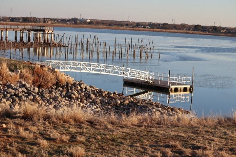 A fishing pier, original posts, and new boardwalk are seen at Lake Wichita.