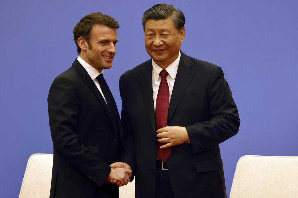 French President Emmanuel Macron, left, and Chinese President Xi Jinping take part in a Franco-Chinese business council meeting in Beijing, Thursday, April 6, 2023.  / Credit: Ludovic Marin / AP