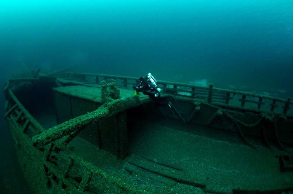 A diver explores the Abiah Shipwreck site on Lake Michigan, 13 miles northeast of the Sheboygan Breakwater Lighthouse.