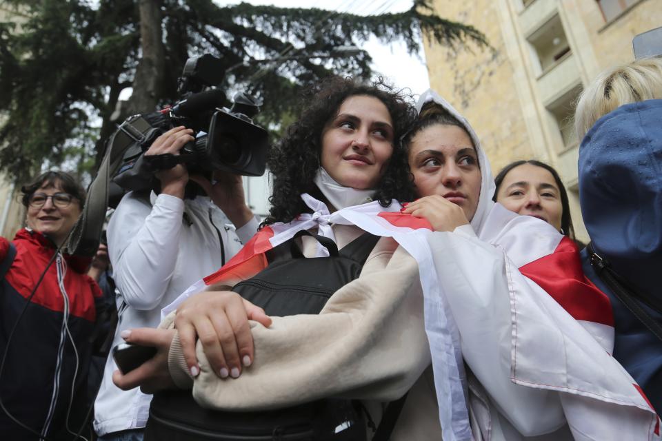 Demonstrators watch as police leave an area around the Parliament building during an opposition protest against "the Russian law" in the center of Tbilisi, Georgia, on Monday, May 13, 2024. Daily protests are continuing against a proposed bill that critics say would stifle media freedom and obstruct the country's bid to join the European Union. (AP Photo/Zurab Tsertsvadze)