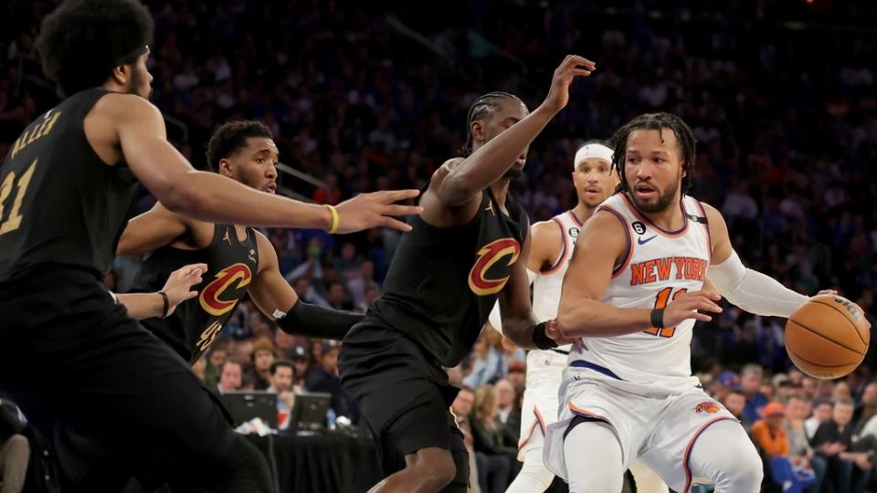 Apr 21, 2023; New York, New York, USA; New York Knicks guard Jalen Brunson (11) controls the ball against Cleveland Cavaliers guards Caris LeVert (3) and Donovan Mitchell (45) and center Jarrett Allen (31) during the fourth quarter of game three of the 2023 NBA playoffs at Madison Square Garden.