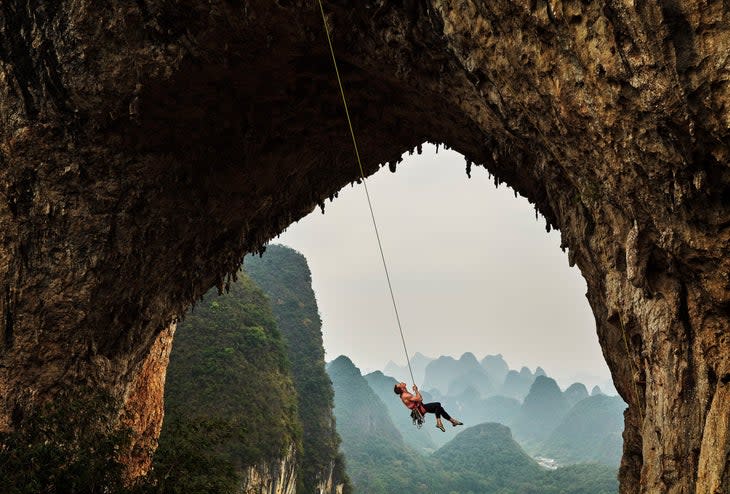 Amy Dunlop of Australia is lowered off after climbing "Moon Walker 5.12d" on Moon Hill on November 07, 2019 in Yangshuo near Guilin, China.