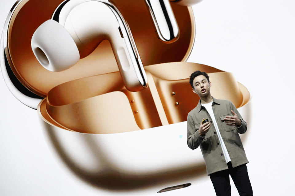 Xiaomi product marketing manager TJ Walton during the presentation of the new Xiaomi Buds 4 Pro ahead of the Mobile World Congress 2023 in Barcelona, Spain, Sunday, Feb. 26, 2023. The four-day show, also known as Mobile World Congress, kicks off Monday in a vast Barcelona conference center. It's the world's biggest and most influential meeting for the mobile tech industry. (AP Photo/Joan Monfort)