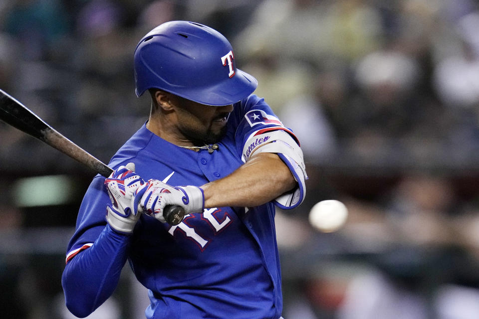 Texas Rangers' Marcus Semien backs away from an inside pitch during the ninth inning of the team's baseball game against the Arizona Diamondbacks on Tuesday, Aug. 22, 2023, in Phoenix. The Diamondbacks won 6-3. (AP Photo/Ross D. Franklin)