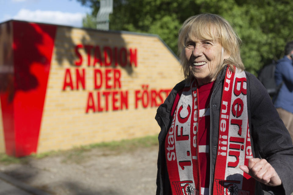 Union Berlin fan Helga Wischke turned up for her team's biggest Bundesliga game of the season against Bayern Munich, in Berlin, Sunday, May 17, 2020, despite the match going ahead without supporters and under strict hygiene measures due to fears over the coronavirus. "We were hoping to get something of the game, but they're not letting anyone through," Wischke told The Associated Press. (AP Photo/Ciarán Fahey)