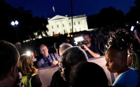 Bishop Michael Curry with the "Reclaiming Jesus Declaration" waits to speak during a vigil outside the White House May 24, 2018 in Washington, DC - Credit: Brendan Smialowski/AFP