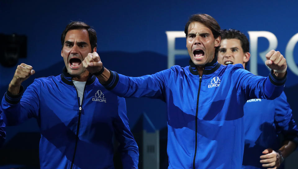 GENEVA, SWITZERLAND - SEPTEMBER 20: Rafael Nadal of Team Europe and teammate Roger Federer celebrate during the singles match between Stefanos Tsitsipas of Team Europe and Taylor Fritz of Team World during Day One of the Laver Cup 2019 at Palexpo on September 20, 2019 in Geneva, Switzerland. The Laver Cup will see six players from the rest of the World competing against their counterparts from Europe. Team World is captained by John McEnroe and Team Europe is captained by Bjorn Borg. The tournament runs from September 20-22. (Photo by Julian Finney/Getty Images for Laver Cup)