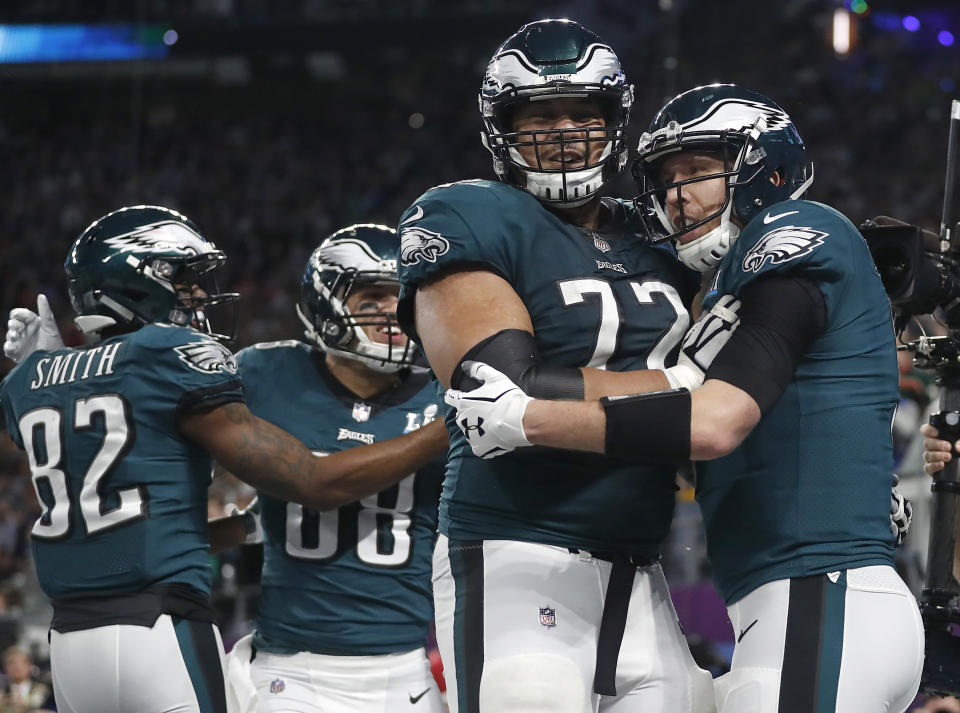 <p>Philadelphia Eagles quarterback Nick Foles, right, celebrates his touchdown catch with Halapoulivaati Vaitai during the first half of the NFL Super Bowl 52 football game against the New England Patriots Sunday, Feb. 4, 2018, in Minneapolis. (AP Photo/Jeff Roberson) </p>