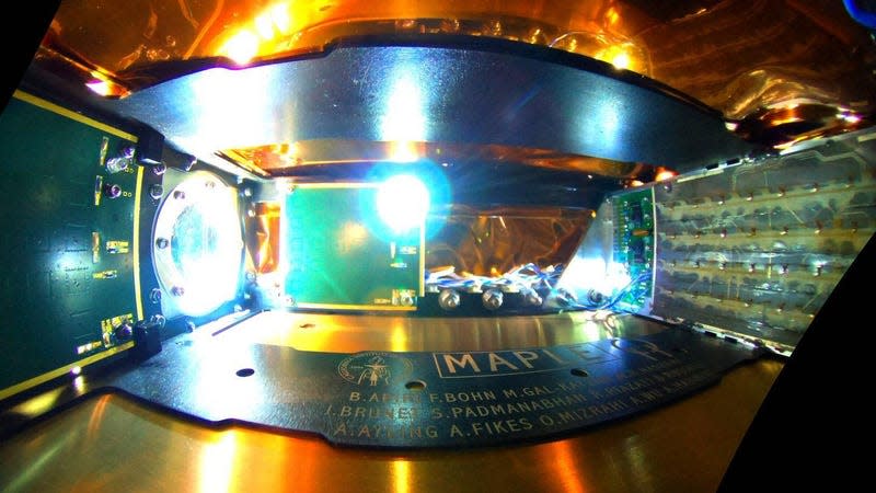 The inside of the space-based Microwave Array for Power-transfer Low-orbit Experiment (MAPLE) which emits collected energy across empty space using an array of transmitters (right) to two receivers (right) to illuminate an LED.