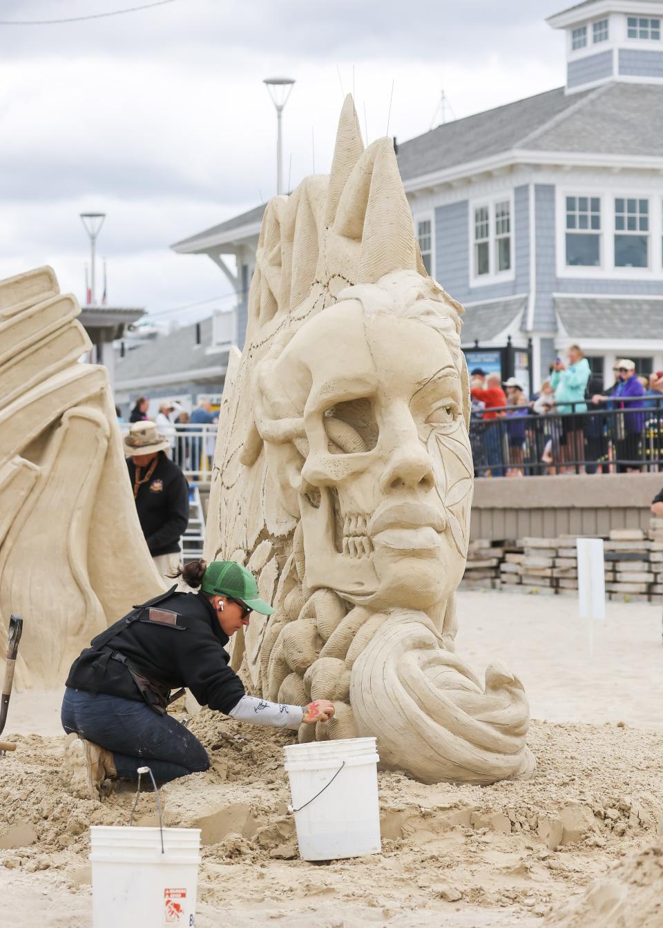 Mélineige Beauregard works on her sculpture "I am Life." Beauregard took home first place and the People's Choice Award in the 2022 Hampton Beach Master Sand Sculpting Classic Saturday, June 18.