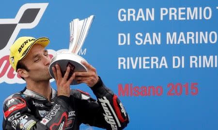 Kalex Moto2 rider Johann Zarco of France kisses the trophy on the podium after winning the San Marino Grand Prix in Misano Adriatico circuit in central Italy September 13, 2015. REUTERS/Max Rossi