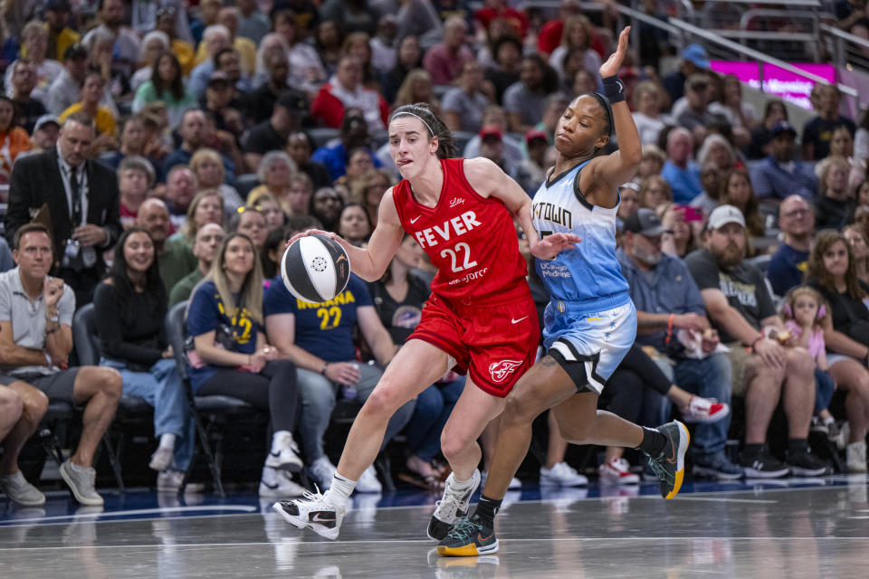 FILE - Indiana Fever guard Caitlin Clark (22) makes contact with Chicago Sky guard Lindsay Allen (15) during a WNBA basketball game Saturday, June 1, 2024, in Indianapolis. (AP Photo/Doug McSchooler, File)