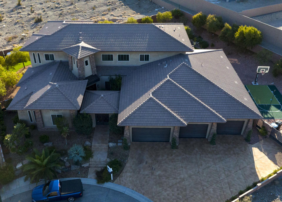 The former home of Matt Beasley, the mastermind behind a $300 million dollar Ponzi scheme that preyed on many LDS church members, is photographed on Wednesday, Dec. 14, 2022, in Las Vegas. Beasley, a longtime Las Vegas attorney was indicted Wednesday, March 29, 2023 on federal charges that he orchestrated a $460 million Ponzi scheme spanning multiple states, from Nevada and Utah to California and Arizona.(Bizuayehu Tesfaye/Las Vegas Review-Journal via AP)