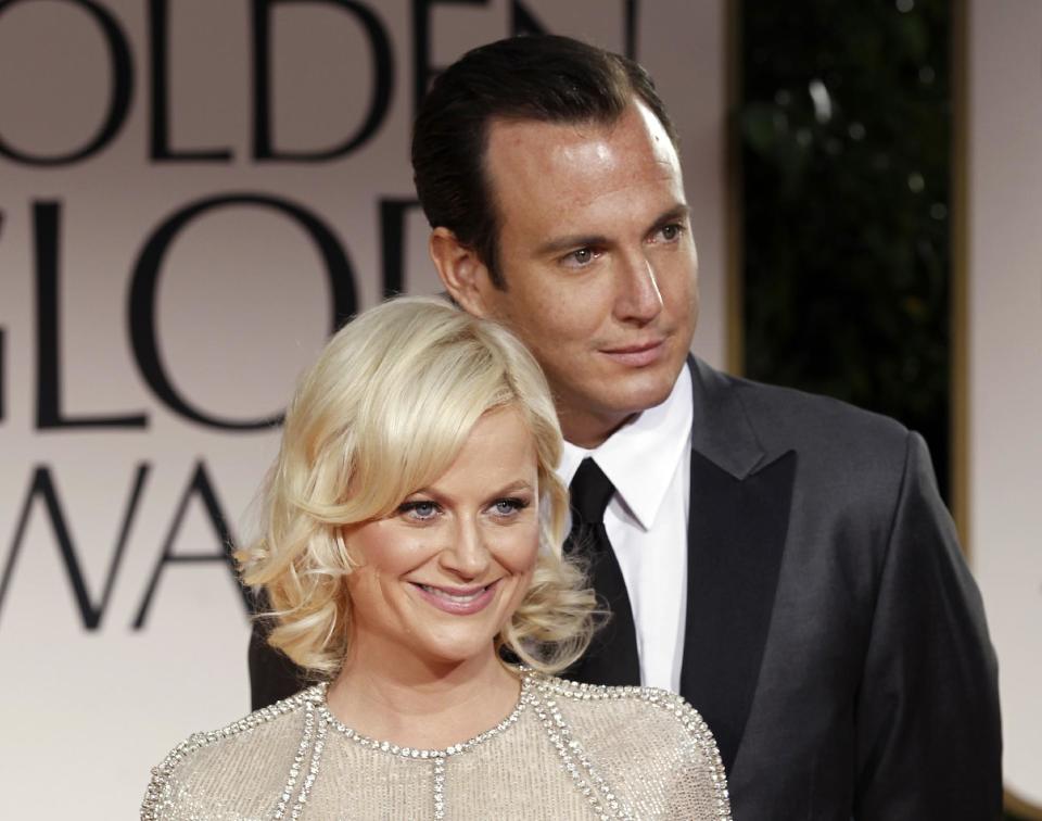 FILE - This Jan. 15, 2012 file photo shows actors Amy Poehler, left, and Will Arnett arriving at the 69th Annual Golden Globe Awards in Los Angeles. Arnett filed for divorce from Poehler on April 8, 2014, in Los Angeles Superior Court more than 18 months after the pair announced they were separating and ending their nine-year marriage. (AP Photo/Matt Sayles, file)