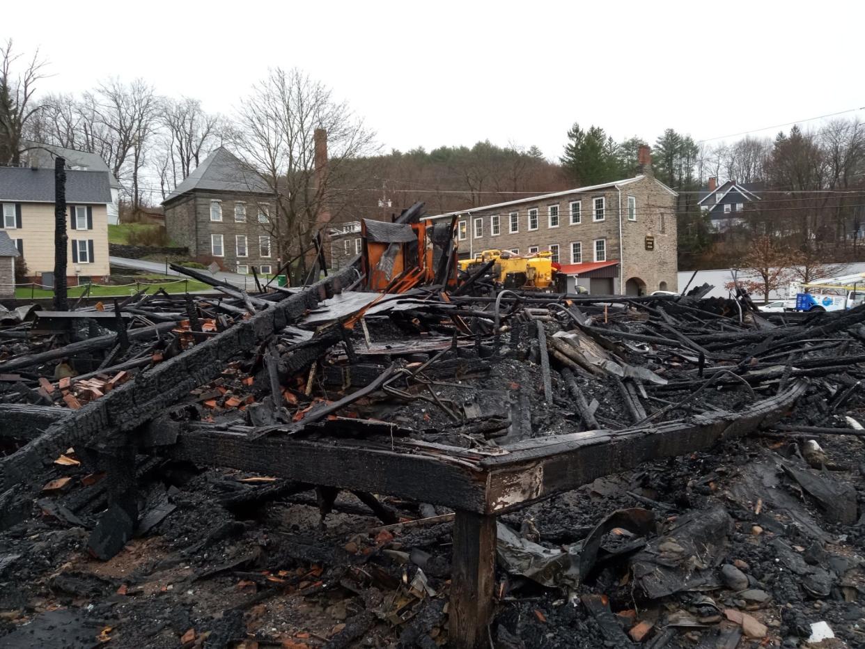 This is a view of the ruins of the vacant White Mills Hotel after it was consumed by fire early Wednesday morning, April 3, 2024. Dorflinger Factory Museum is visible in the background. The wood-frame, two-story hotel, which had been a boarding house as well as a restaurant and tavern at one point, dated to 1901.