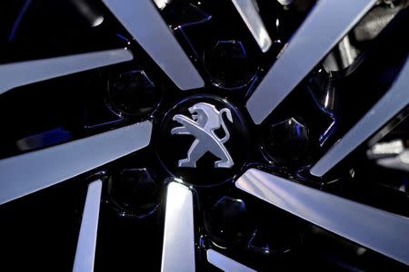 FILE PHOTO: The Peugeot logo on a Peugeot 508 before a PSA Group news conference on the company's 2017 annual results announcement at their headquarters in Rueil-Malmaison, near Paris, France, March 1, 2018. REUTERS/Benoit Tessier/File Photo