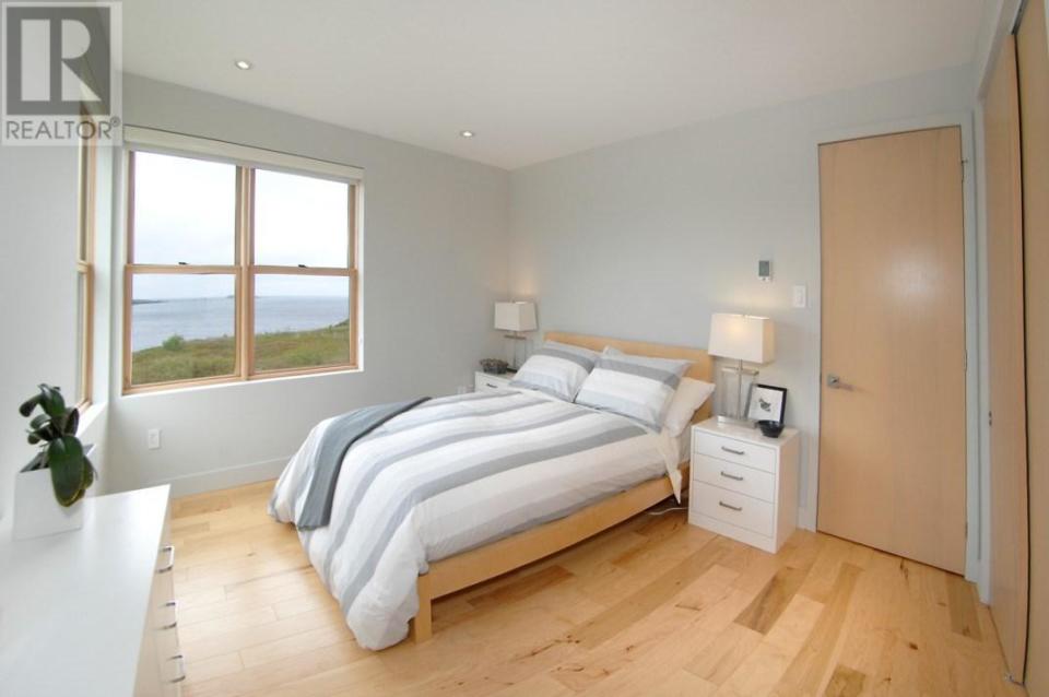 <p><span>200 Point Road, Bryant’s Cove, Nfld.</span><br>The master suite has a walk-in closet/dressing room, and a custom ensuite. The home currently has two bedrooms as it’s configured, but can be adjusted to four.<br>(Photo: Zoocasa) </p>