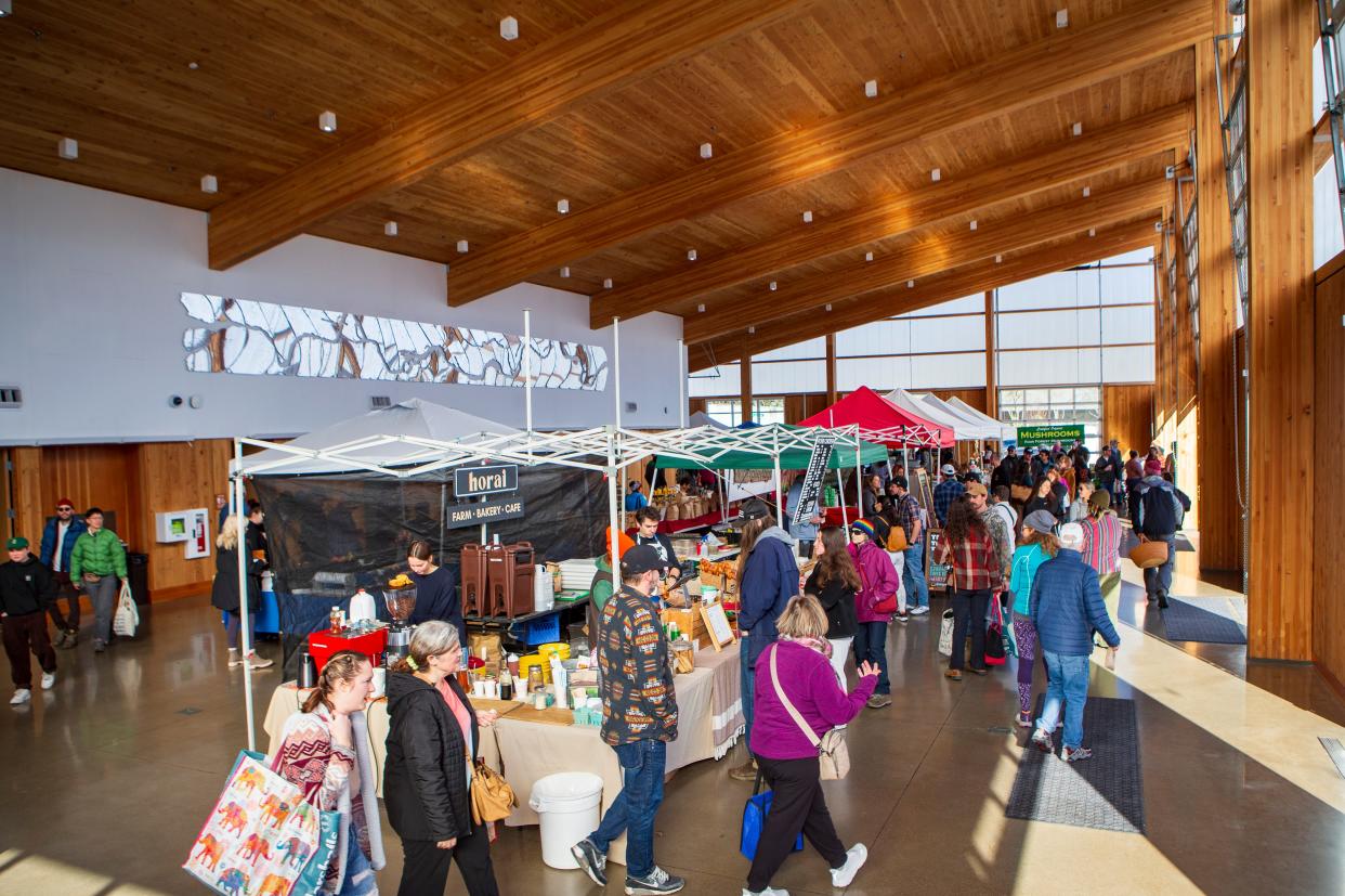People pass through the Farmers Market Pavilion on the opening day of the Lane County Farmers Market’s Winter Market in this file photo from Feb. 3. The popular market is part of a unique culture that helped Eugene to place highly on Money.com's recent rankings of the top places to live in the U.S.