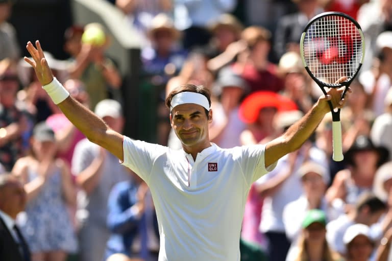 New look: Roger Federer celebrates after beating Serbia's Dusan Lajovic 6-1, 6-3, 6-4 on Monday