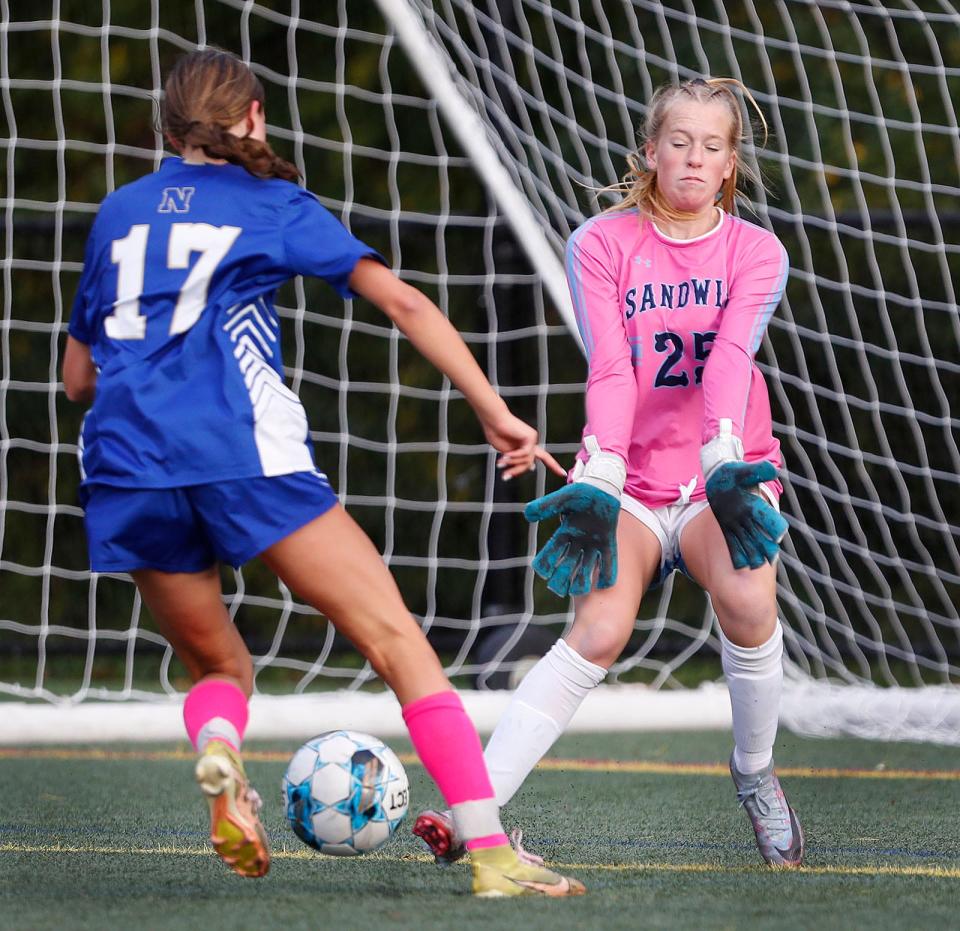 Norwell #17 Hannah Morse goes head to head with Sandwich keeper Abigail Kinney who blocked the shot.

Norwells girls soccer hosts Sandwich High on
Monday, Oct. 16, 2023