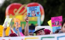 <p>Participants hold up signs bearing names and photos of victims of Orlando’s Pulse nightclub massacre, in the “New Orleans Pride” parade, a gay pride parade, in New Orleans, Saturday, June 18, 2016. (AP Photo/Gerald Herbert) </p>