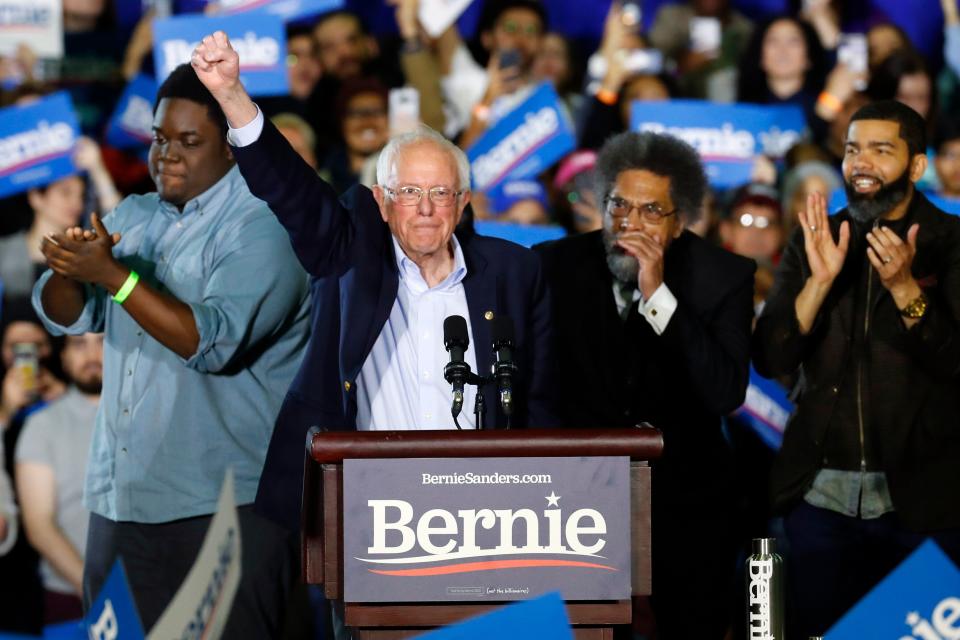 Sen. Bernie Sanders (I-Vt.) waves during a campaign rally in Detroit on March 6. (ASSOCIATED PRESS)