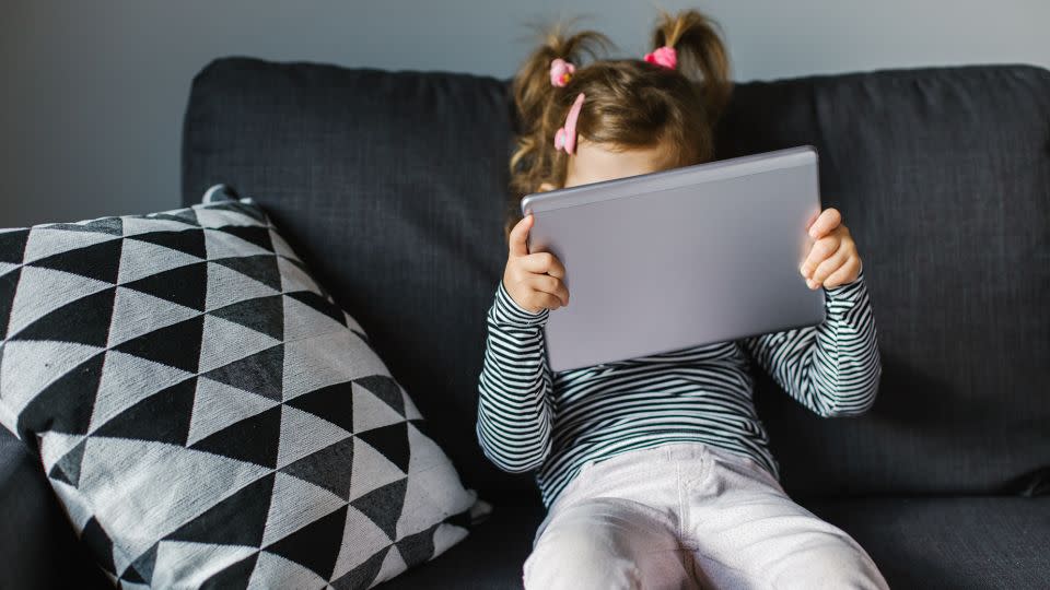 When parents, teachers and caregivers offer kids technology to soothe them, the children miss an opportunity to manage their negative emotions themselves. - CokaPoka/iStockphoto/Getty Images