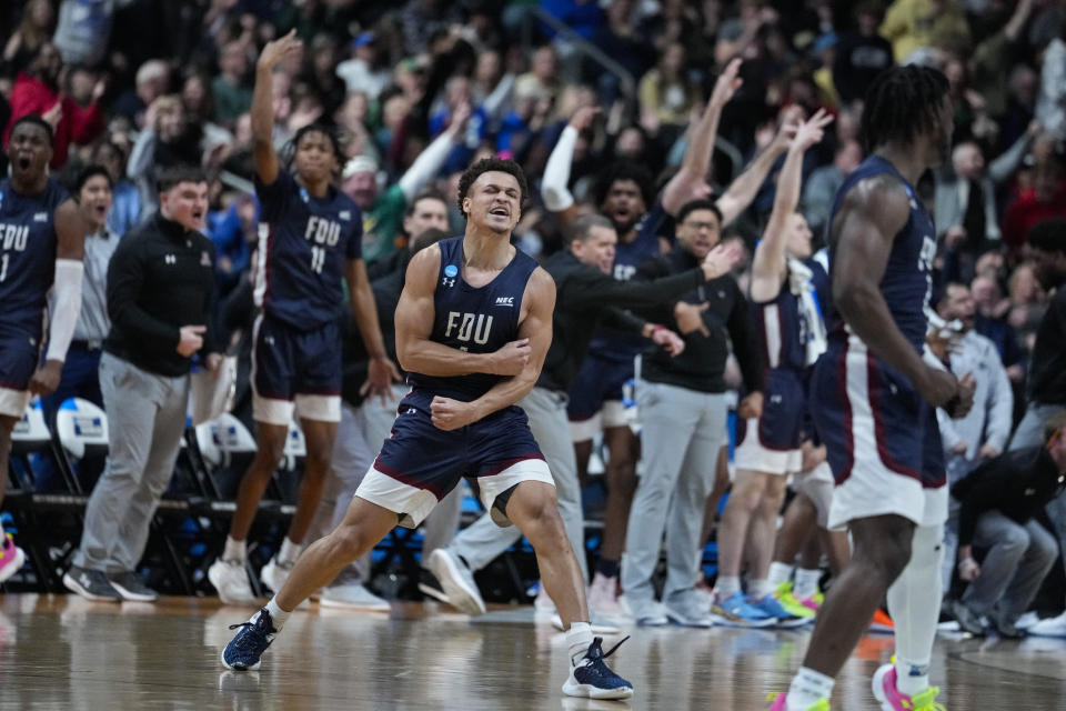 Fairleigh Dickinson guard Grant Singleton (4) celebrates after a basket against Purdue in the second half of a first-round college basketball game in the men's NCAA Tournament in Columbus, Ohio, Friday, March 17, 2023. (AP Photo/Michael Conroy)