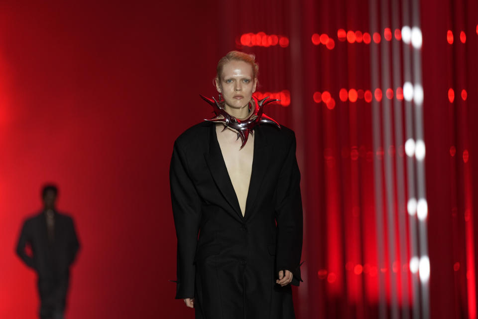 A model wears a creation as part of the Jordanluca men's and women's Spring Summer 2024 collection, unveiled during the Fashion Week in Milan, Italy, Saturday, June 17, 2023. (AP Photo/Antonio Calanni)