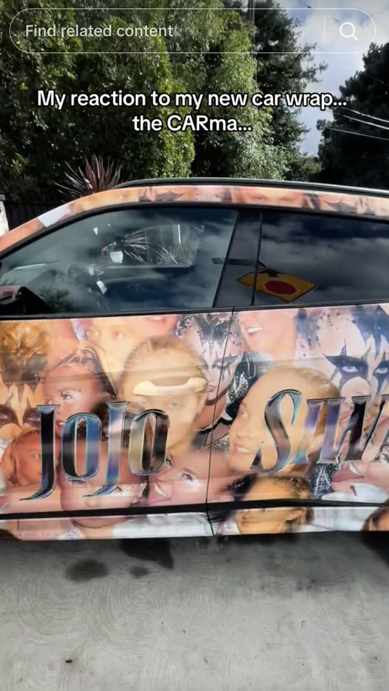 Vehicle with a custom wrap featuring multiple images of JoJo Siwa and text "JoJo Siwa."