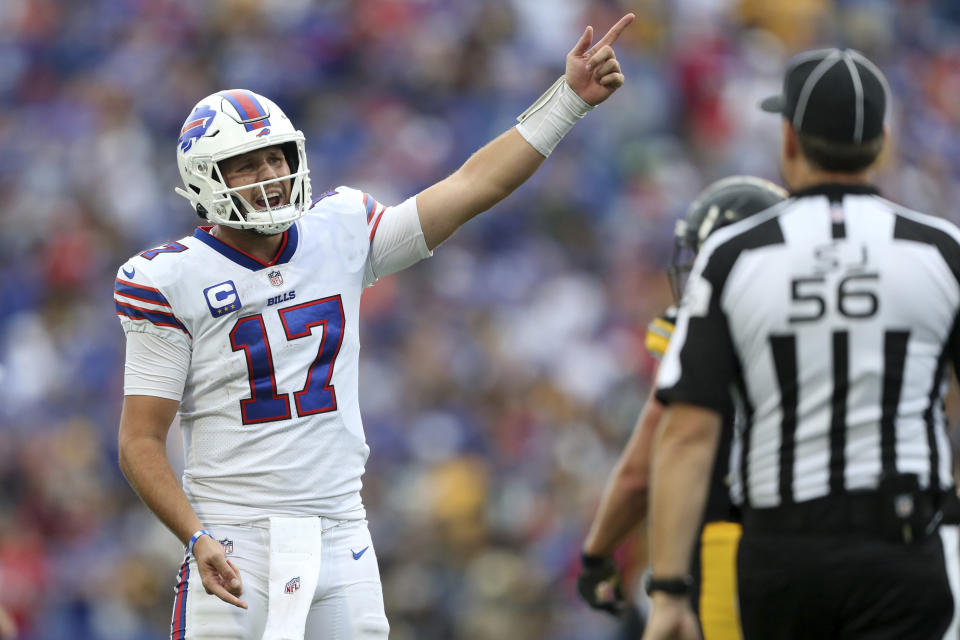 Buffalo Bills quarterback Josh Allen (17) expresses himself to side judge Allen Baynes (56) during the second half of an NFL football game against the Pittsburgh Steelers in Orchard Park, N.Y., Sunday, Sept. 12, 2021. (AP Photo/Joshua Bessex)