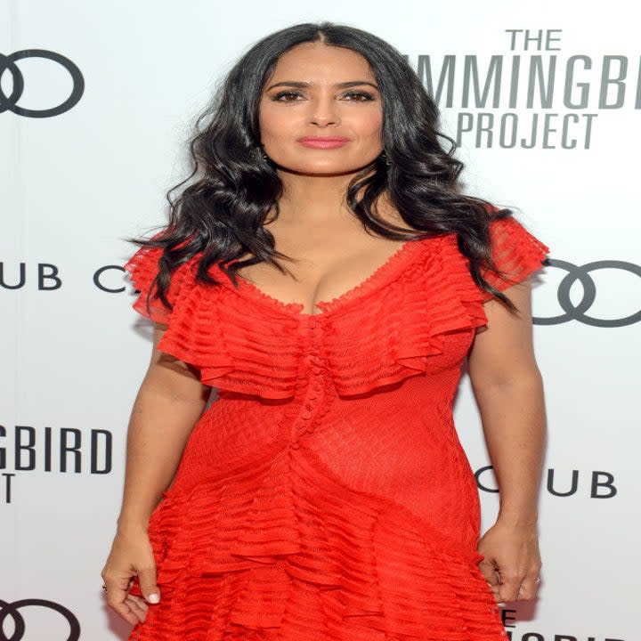 Salma Hayek poses for photographers on the red carpet