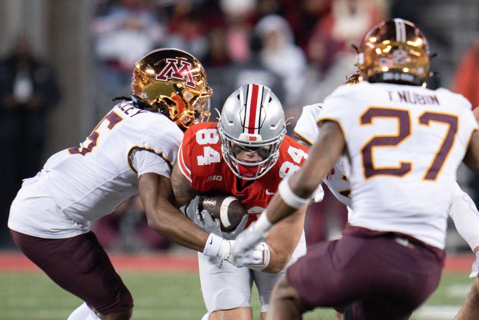 Ohio State Buckeyes tight end Joe Royer (84) tries to run by Minnesota defensive back Justin Walley during their game in November at Ohio Stadium. Royer, out of Elder High School, is now a UC Bearcat.