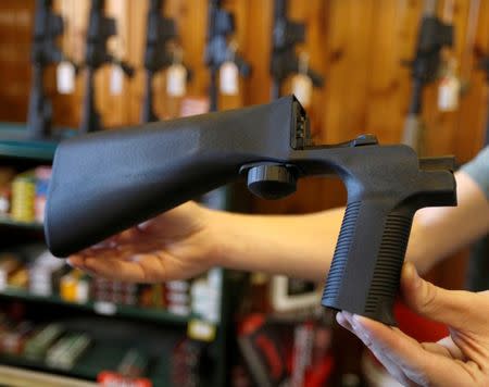 FILE PHOTO: An example of a bump stock that attaches to a semi-automatic rifle to increase the firing rate is seen at Good Guys Gun Shop in Orem, Utah, U.S. on October 4, 2017. REUTERS/George Frey/File Photo