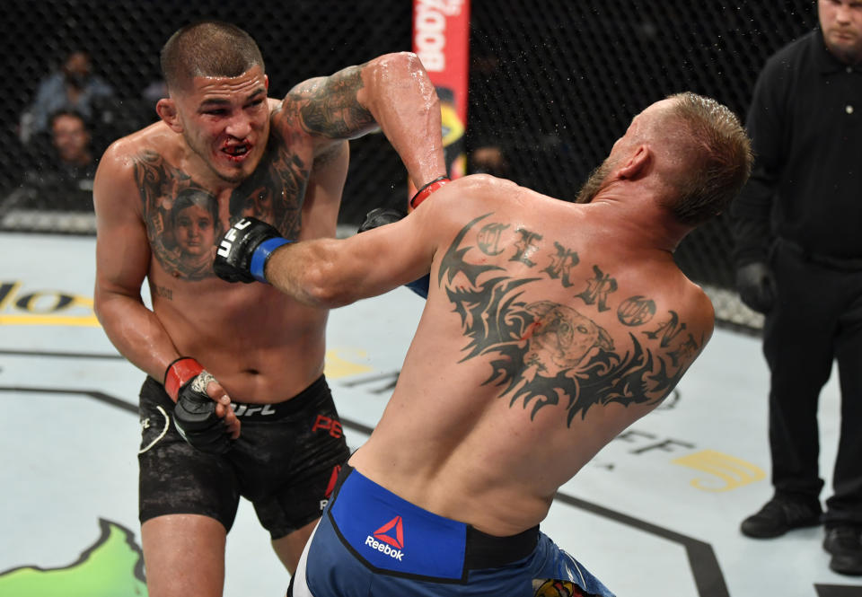 Anthony Pettis punches Donald Cerrone in their welterweight fight during UFC 249 at VyStar Veterans Memorial Arena on May 09, 2020, in Jacksonville, Florida.