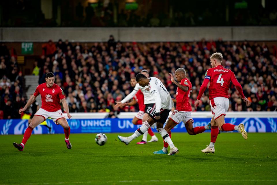 NOTTINGHAM, ENGLAND - JANUARY 25:  Marcus Rashford of Manchester United scores a goal to make the score 0-1 during the Carabao Cup Semi Final 1st Leg match between Nottingham Forest and Manchester United at City Ground on January 25, 2023 in Nottingham, England. (Photo by Ash Donelon/Manchester United via Getty Images)