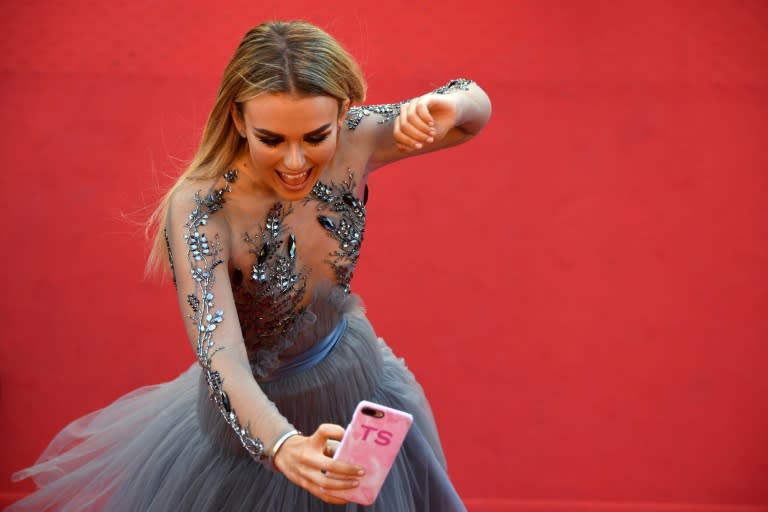 British singer Tallia Storm, who has 213,000 Instagram followers, poses for selfies on the red carpet at Cannes