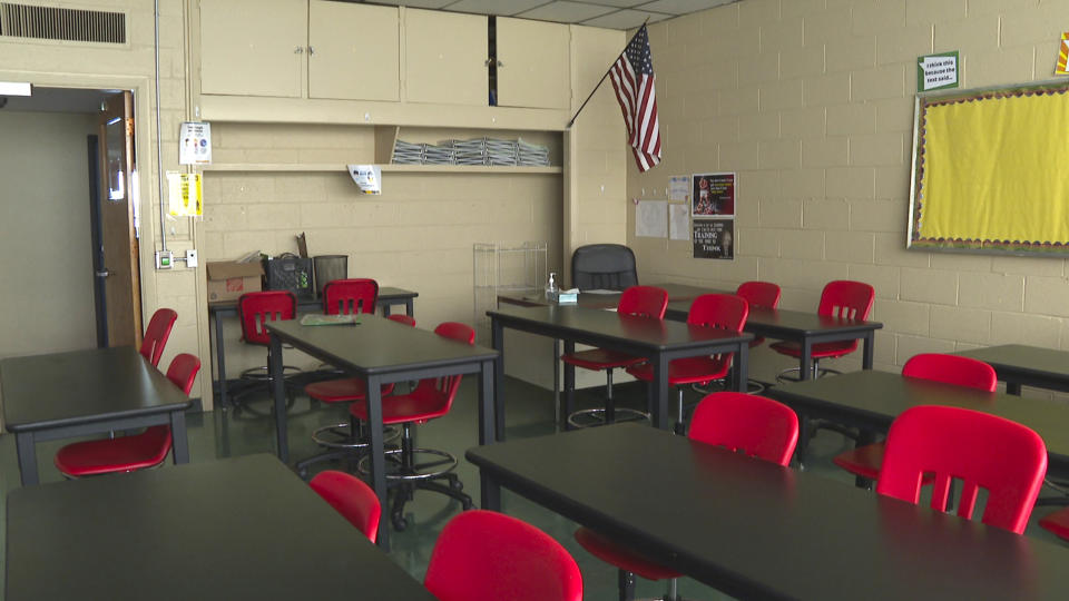 In this image made from video, an empty classroom is shown at David Ellis Academy in Detroit, Monday, Feb. 8, 2021. It's coming up on a year since most of the students at the pre-K through 8th grade public charter school last had an in-person school day. (AP Photo/Mike Householder)