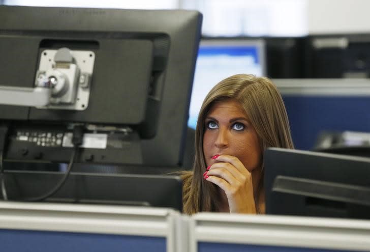 A risk manager works on the trading floor at IG Index in London, Britain August 25, 2015. REUTERS/Suzanne Plunkett