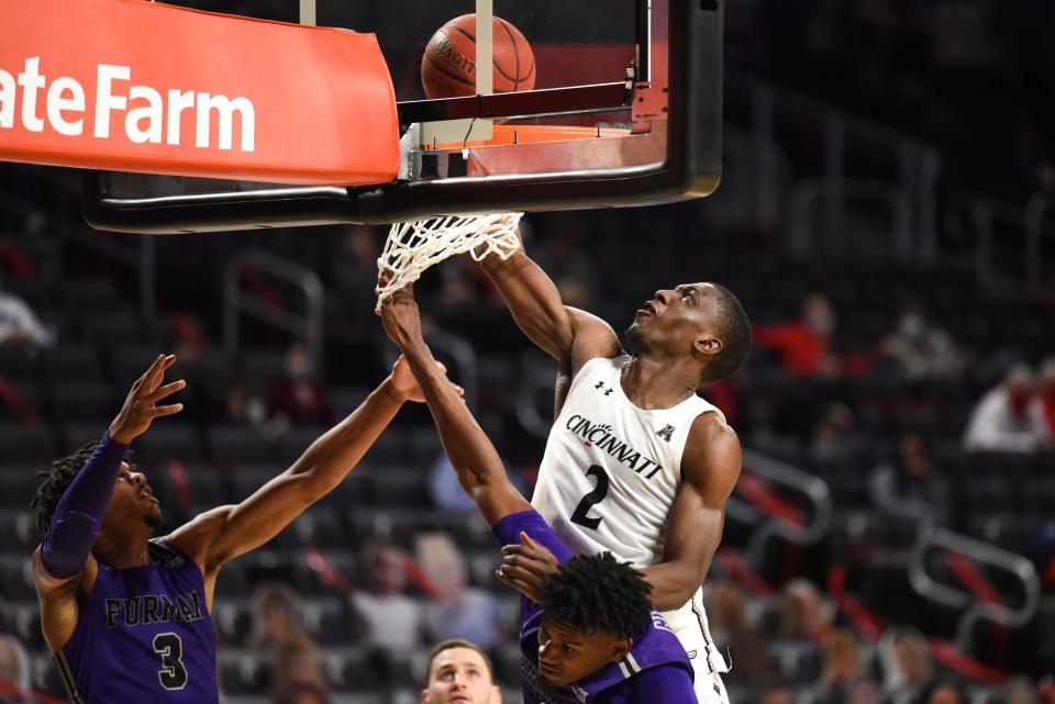 UC's Keith Williams leaps to score during the game between the UC Bearcats and the Furman Paladins. Williams has returned to play with his former teammates in the Monday TBT quarterfinal at University of Dayton Arena.