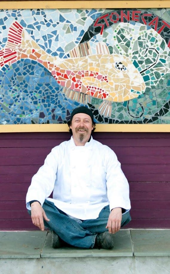 Scott Edward Signori poses in front of his restaurant, the Stonecat Café, in this undated picture.