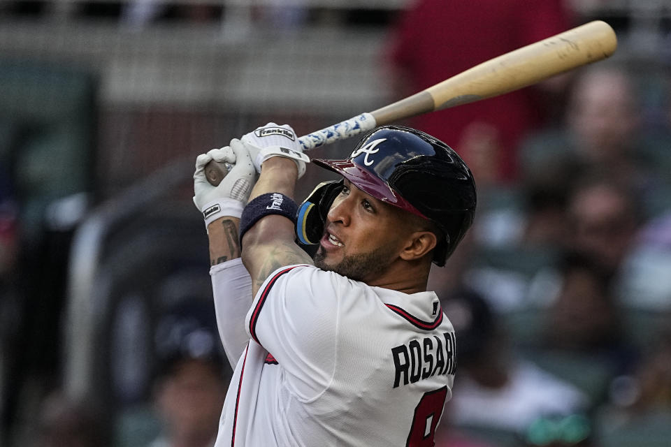 FILE - Atlanta Braves' Eddie Rosario watches his two-run home run against the New York Yankees during the second inning of a baseball game Wednesday, Aug. 16, 2023, in Atlanta. Outfielder Eddie Rosario and the Washington Nationals have agreed to a minor league contract with a non-roster invitation to spring training, a person familiar with the deal told The Associated Press on Wednesday, March 6, 2024.(AP Photo/John Bazemore, File)